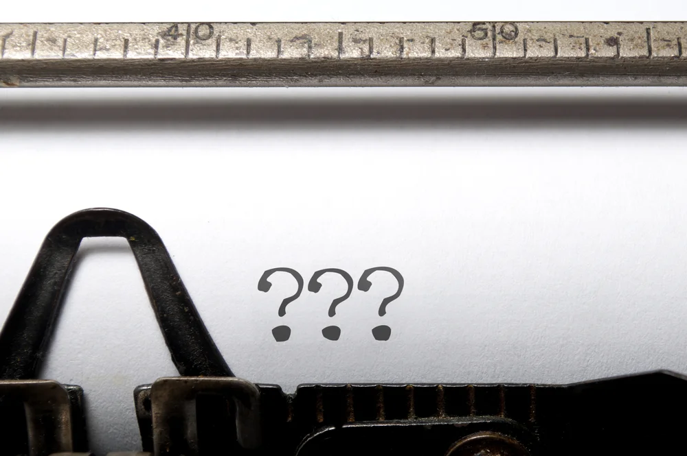 Typewriter With Question Marks On The Paper