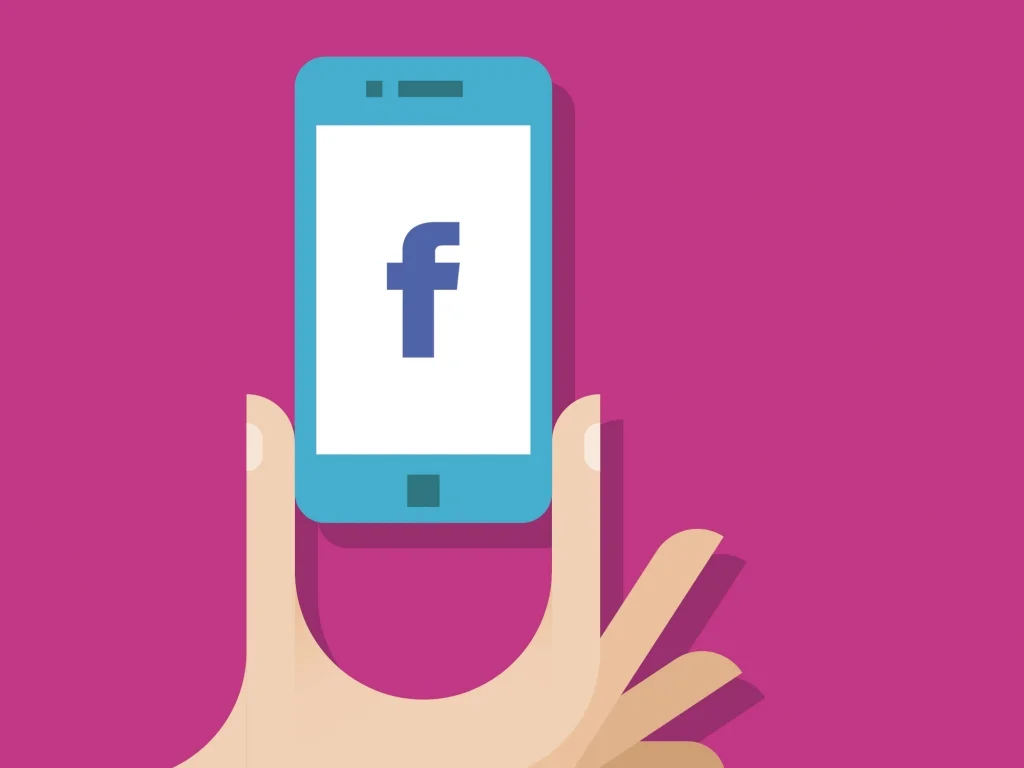 Graphic Of A Hand Holding A Cell Phone With The Facebook Logo On It