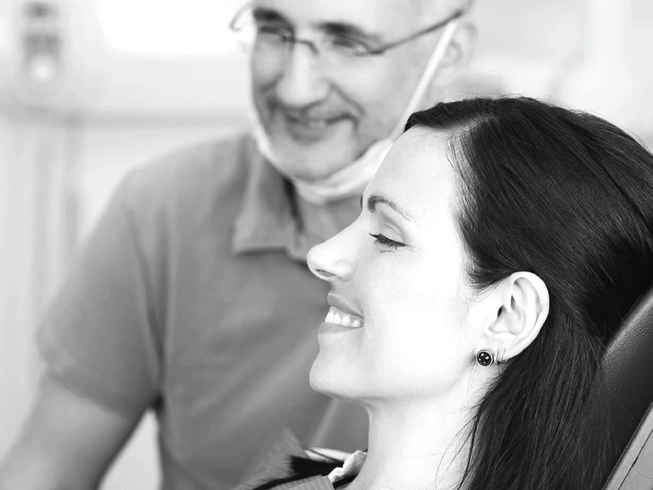 Abundant Dental Photography Of Woman With Dentist Smiling While Looking At Her Teeth In A Mirror