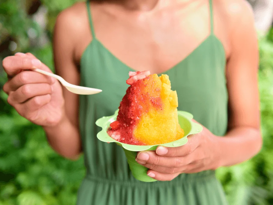 Woman Eating Red And Orange Shaved Ice