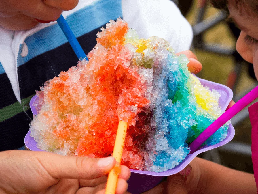 Family Sharing Rainbow Colored Shaved Ice