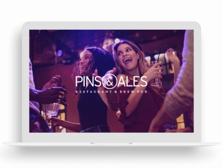 Pins And Ales Website Displayed On Laptop
