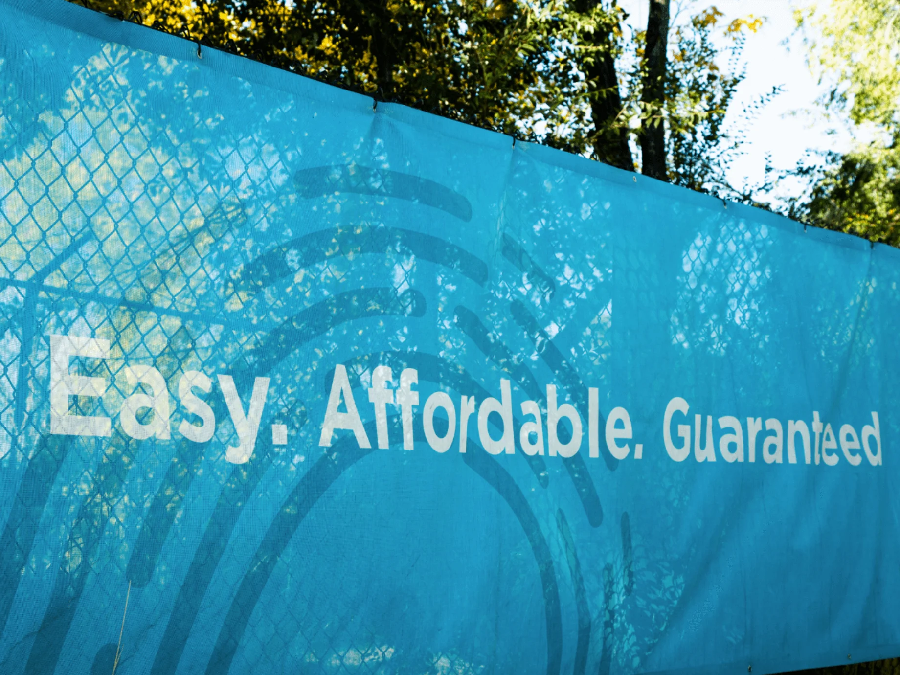 Easy. Affordable. Guaranteed. Auric Solar Branding On Fence