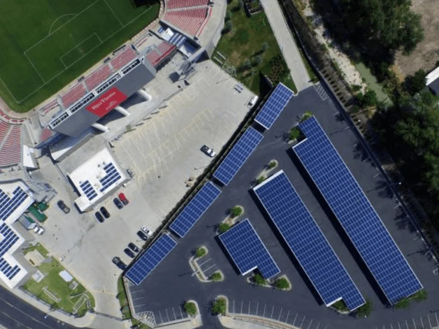 Overhead View Of Stadium Parking Lot With Auric Solar Panels