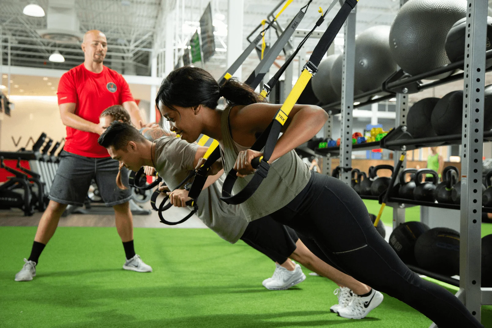 A VASA Personal Trainer Assisting VASA Members