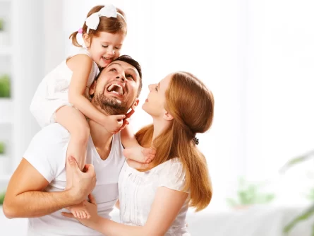 Smiling Family Dressed In White