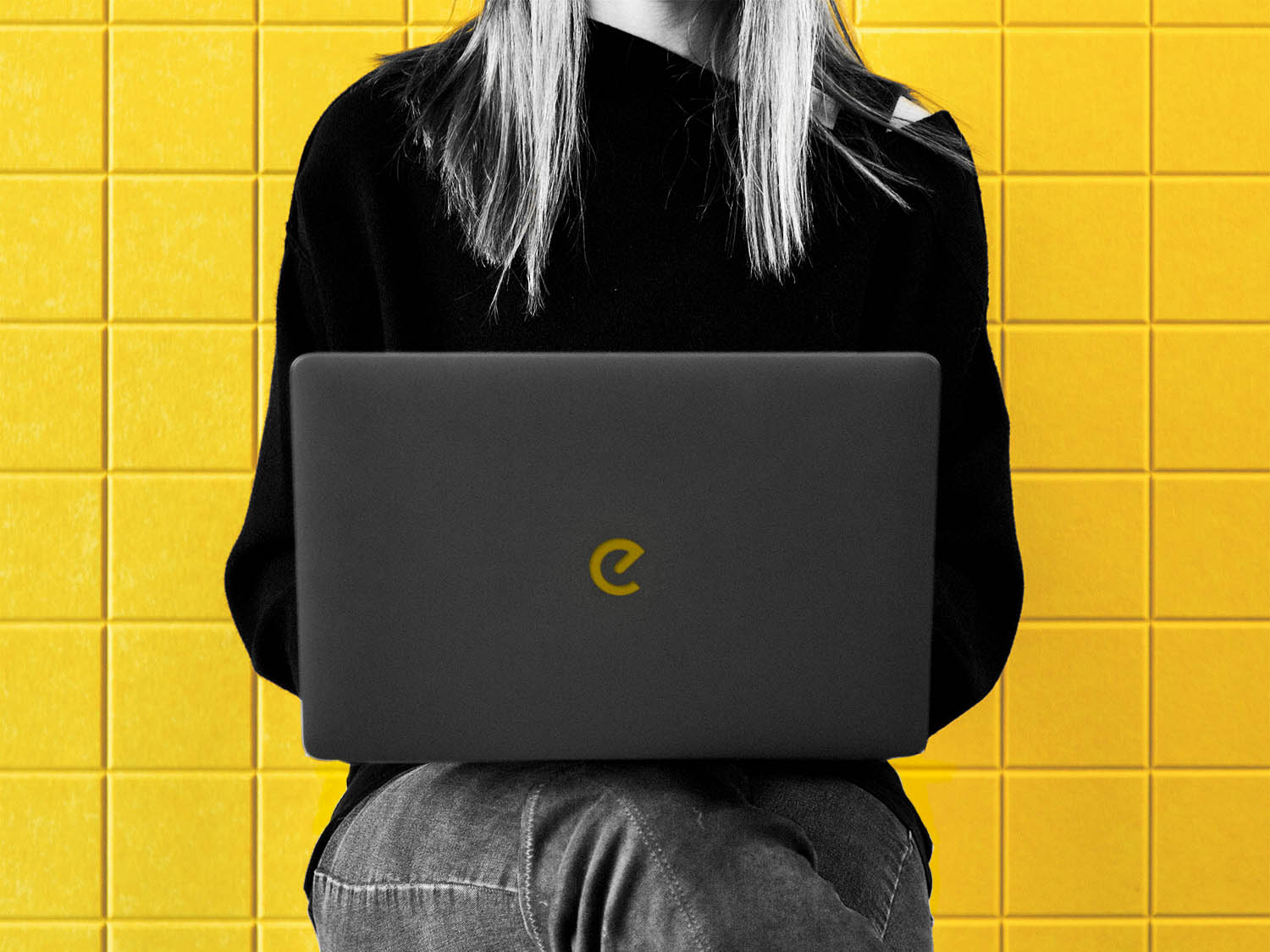 Woman using laptop with Epic Marketing logo