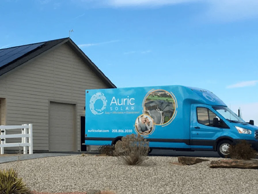 Auric Solar Company Van Parked In A Client's Driveway