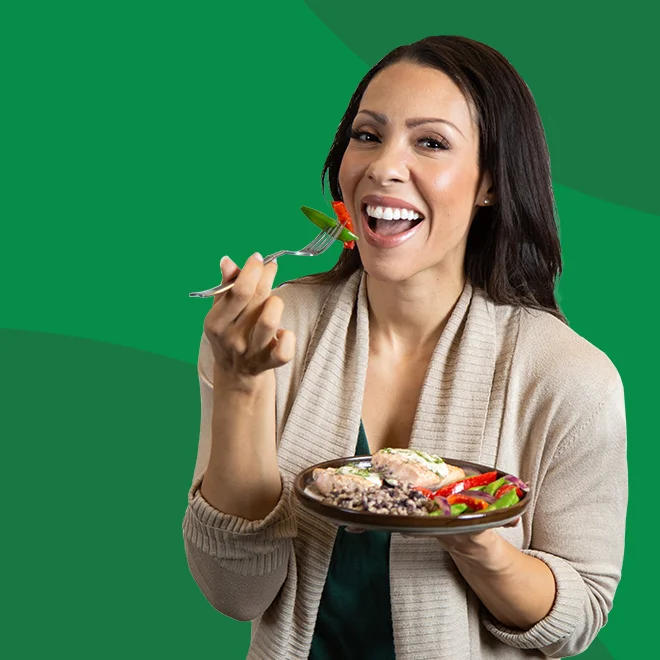 Woman Smiling And Eating A QuickFresh Meal