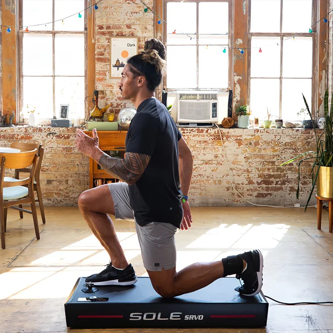 Man Exercising At Home On Sole Fitness Product
