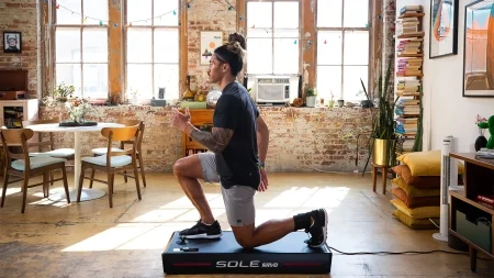 Person At Home Using Sole Fitness Product