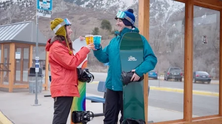 Snowboarders In The Mountains Drinking Beans And Brews